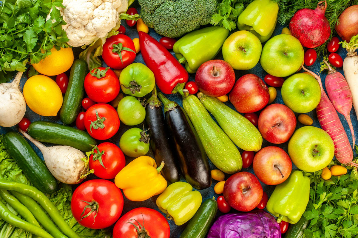 top-view-vegetable-composition-with-fresh-fruits-blue-table (1)